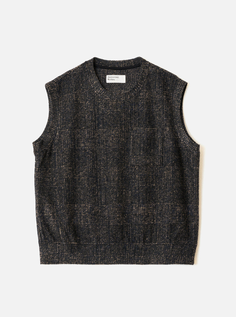 The Navy Deca Light Knit Sleeveless Crew is laid flat on a light grey surface. This sleeveless vest features a textured muted check pattern in navy and tan, a crew neckline with an interior brand label, wide armholes, and a straight ribbed hem.