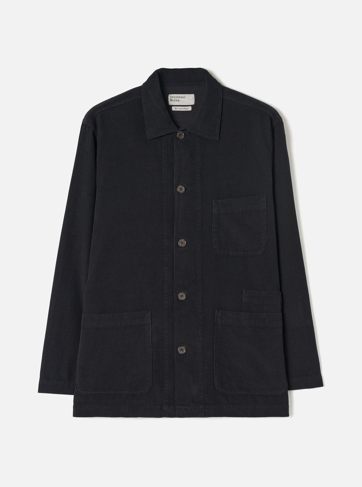 Front view of the Black Fine Cord Bakers Overshirt presented on a plain white background. The product shot highlights the classic collar, button-up front closure, fine pin-corduroy texture, and multiple patch pockets.