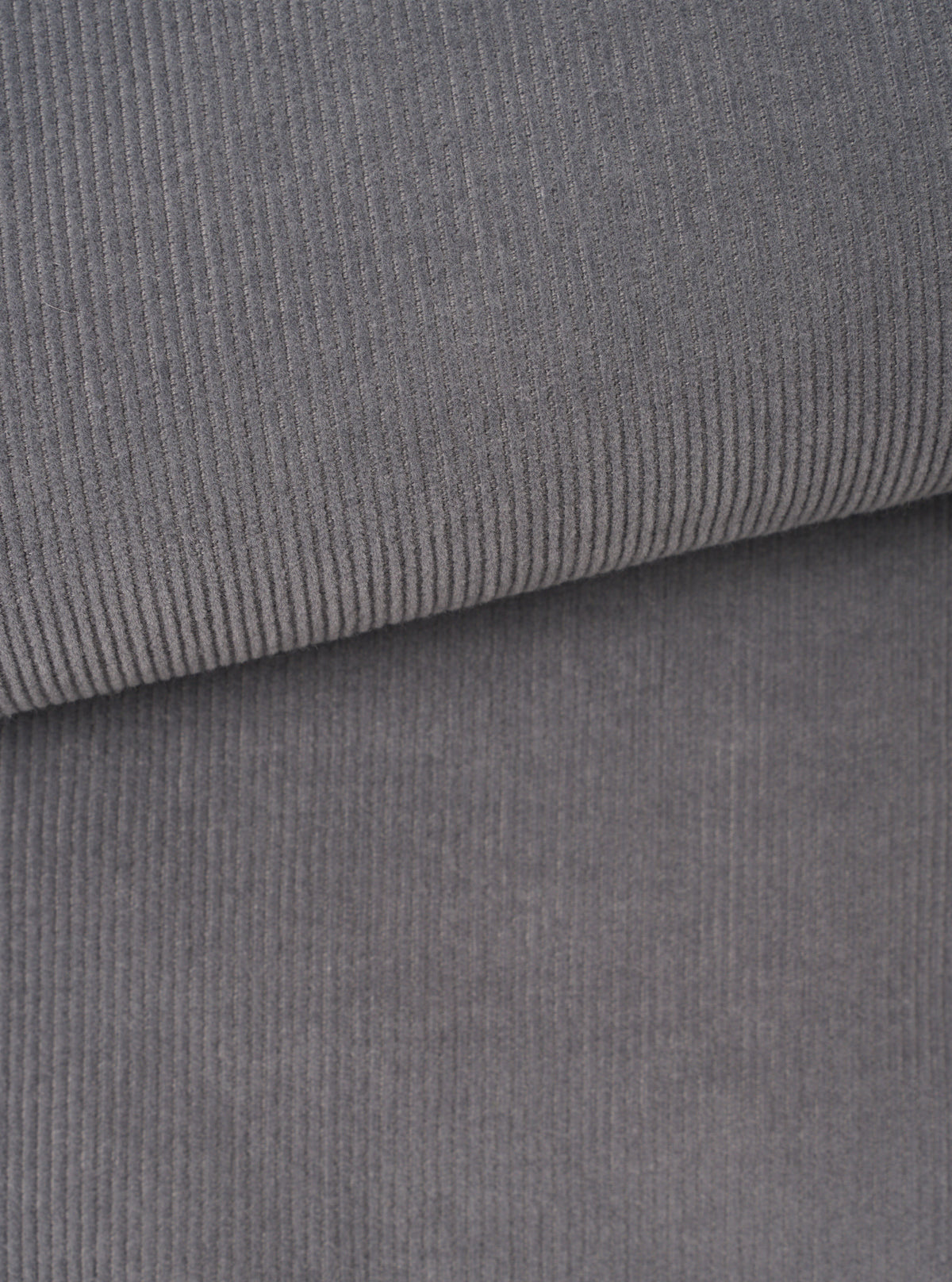A detailed close-up fabric swatch of the Universal Works Grey Fine Cord Bakers Overshirt, displaying the fine-wale cotton corduroy texture and grey tone up close against a plain background.