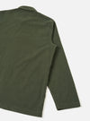 Back view of a male model wearing the Universal Works Olive Fine Cord Bakers Overshirt, displaying the relaxed fit, straight hem, and fine-wale olive green corduroy fabric against a plain white background.