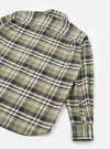 Back view of a male model wearing the Universal Works Olive Jazz Check Standard Shirt against a plain background, showing the tailored fit, neat shoulder yoke, and olive woven check cotton fabric.