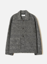 A male model wearing the Universal Works Grey Marl Wool Mix Knit Rams Jacket, standing against a plain neutral background, highlighting the full-zip closure, collar, and grey marl knit texture.
