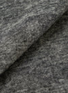 An extreme close-up fabric swatch of the Universal Works Grey Marl Wool Mix Knit Rams Jacket, showcasing the rich texture and flecked grey wool blend knit material against a plain background.