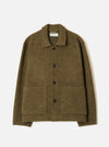 A full-length front view of a model wearing the Olive Wool Mix Knit Rams Jacket against a plain neutral studio background, showcasing the jacket's button front, olive green textured knit fabric, and front patch pockets.