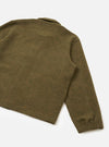 A full-length back view of a model wearing the Olive Wool Mix Knit Rams Jacket in a clean studio setting, highlighting the back seam construction, relaxed fit, and cozy wool mix fleece texture in olive green.