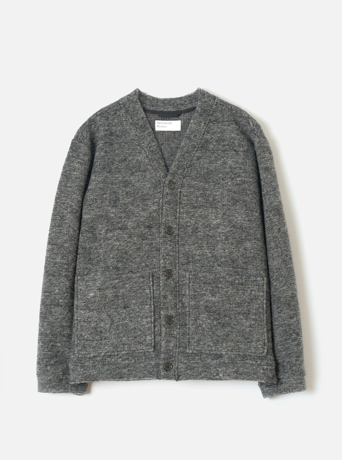 A full-length front view of a model wearing the Grey Marl Wool Mix Knit Advance Cardigan in a minimal studio setting, displaying its button-down front, V-neckline, and flecked grey wool mix knit construction.