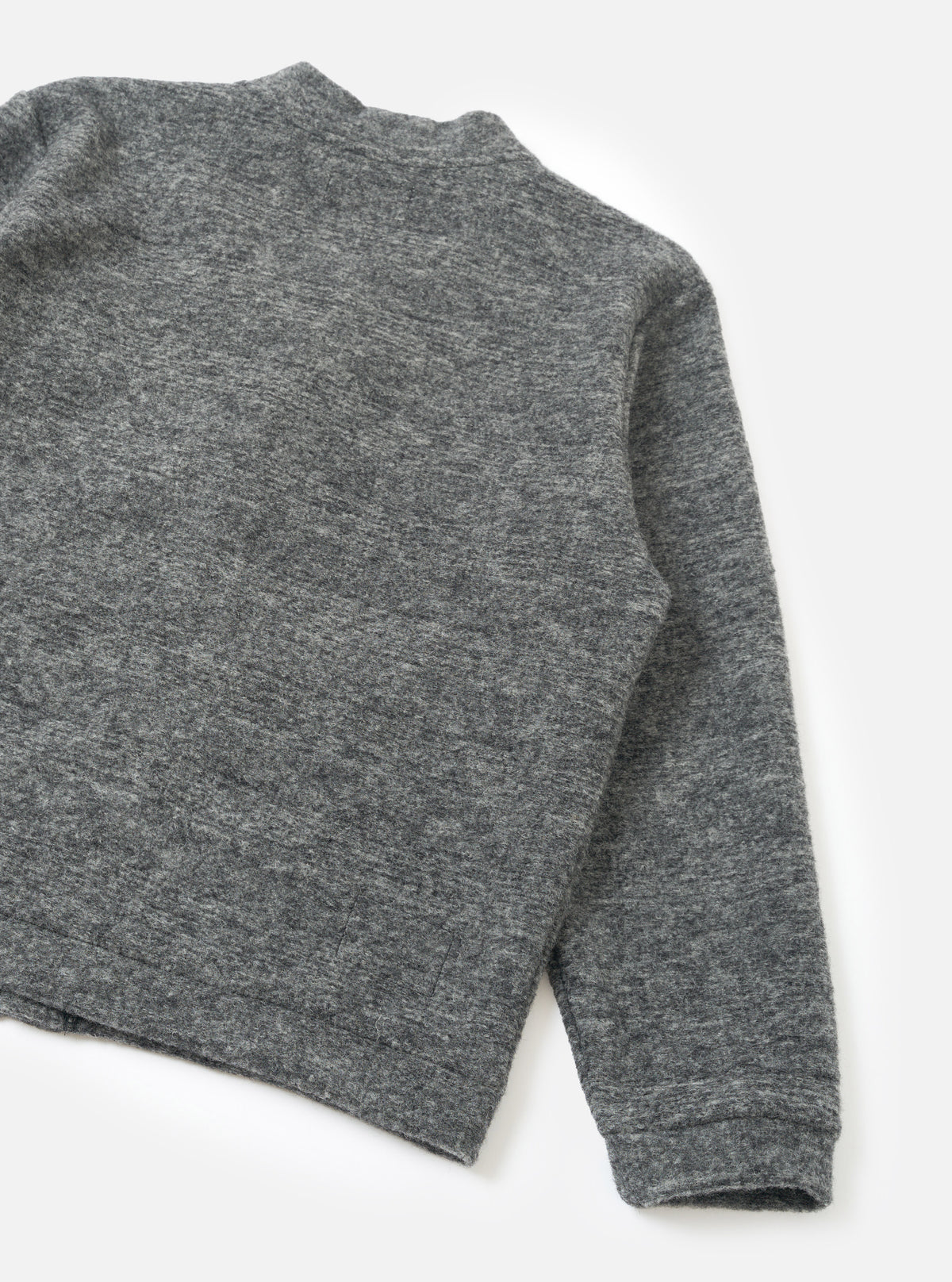 A full-length back view of a model wearing the Grey Marl Wool Mix Knit Advance Cardigan against a light background, highlighting the garment's comfortable fit, clean hemline, and textured grey marl fleece.