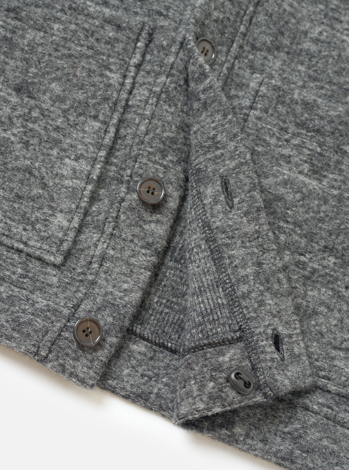 A close-up view of a model wearing the Grey Marl Wool Mix Knit Advance Cardigan, emphasizing the V-neck collar, button detailing, and rich marled grey wool blend fabric texture in studio lighting.