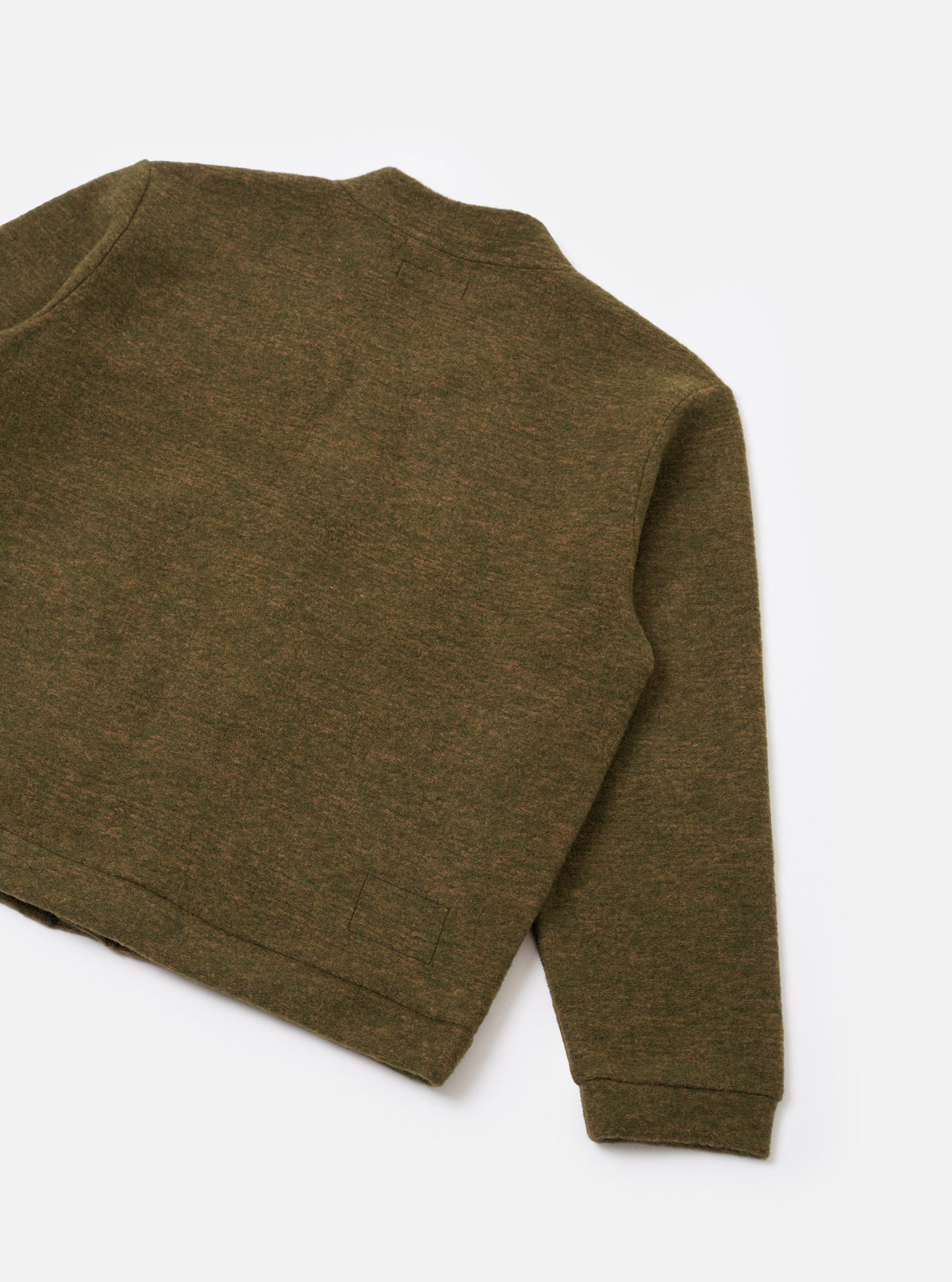 A full-length back view of a model wearing the Olive Wool Mix Knit Advance Cardigan against a plain neutral backdrop, detailing the relaxed silhouette, ribbed trim, and olive wool mix fleece texture.