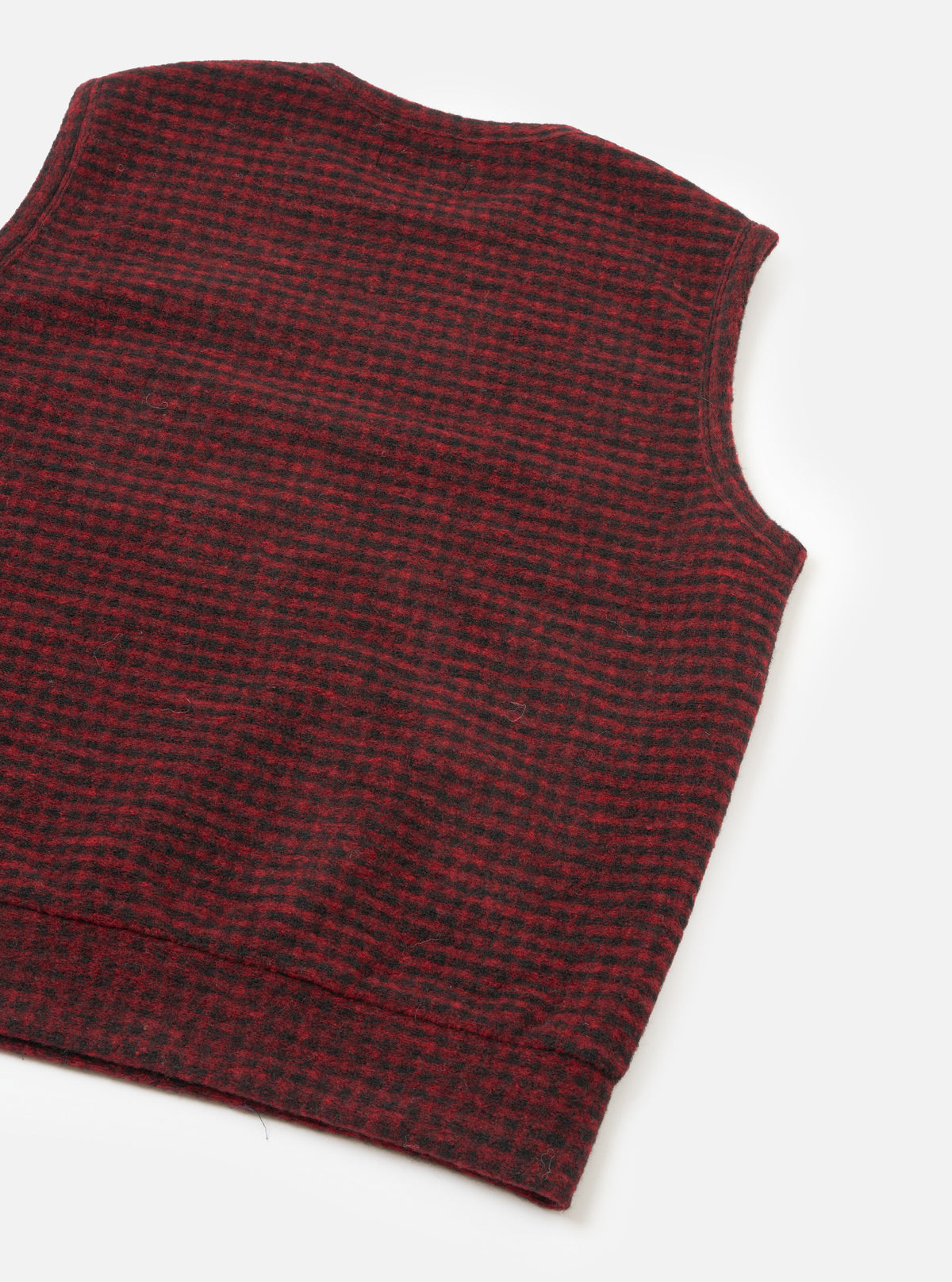 A full-length back view of a model wearing the Black/Red 533 Wool Mix Giacomo Tank Top against a neutral studio background, showing the sleeveless silhouette and back pattern of the wool mix vest.