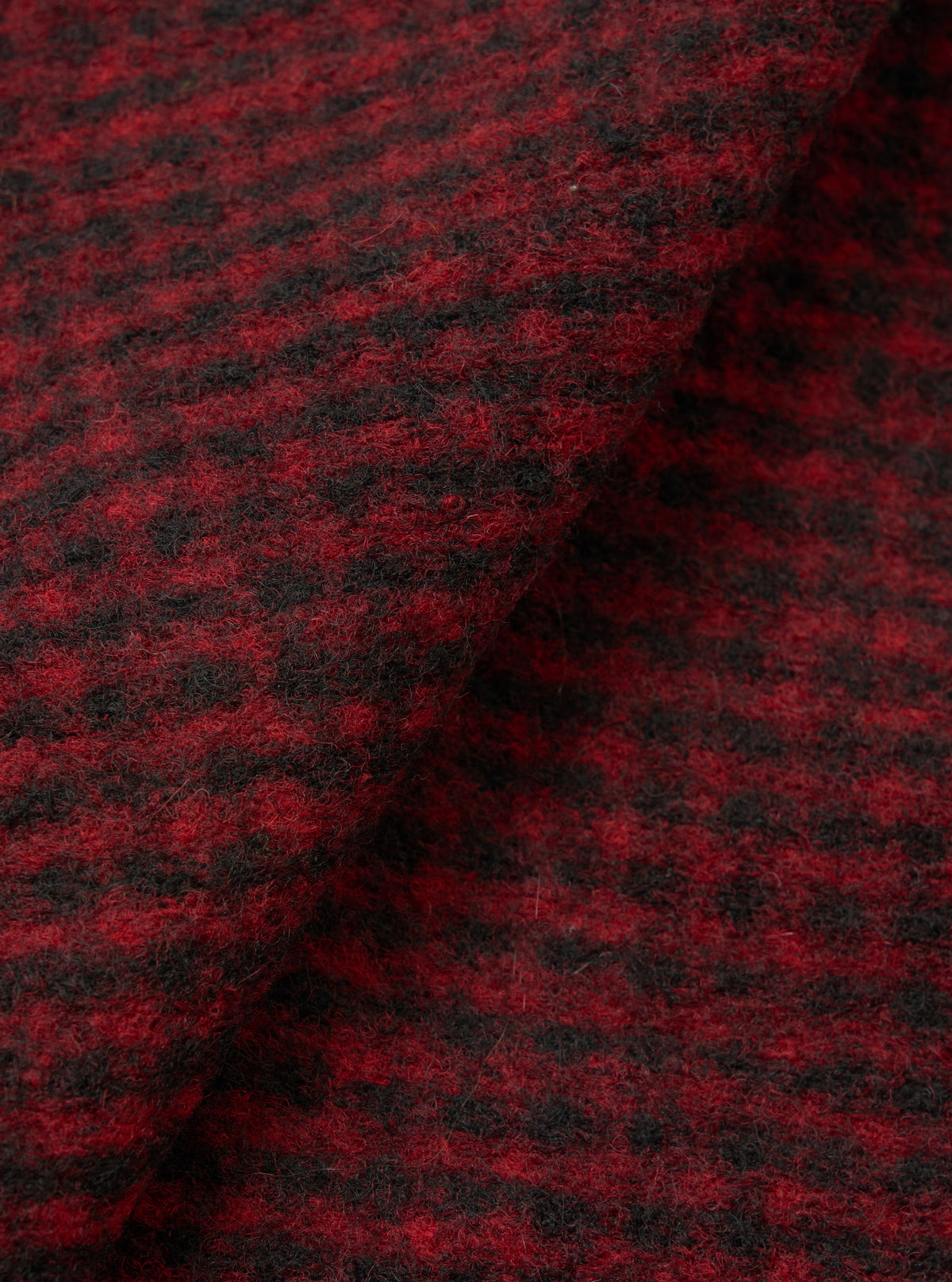 A detailed close-up swatch image of the Black/Red 533 Wool Mix Giacomo Tank Top fabric on a plain white background, showing the knit texture and vibrant black and red wool mixture fibers.
