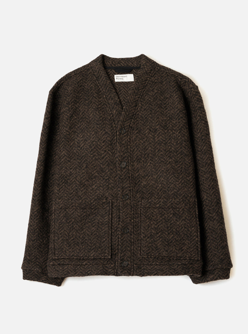 A front view photograph of the Brown Raven Fleece Advance Cardigan presented on a plain white background, showing the V-neckline, button front closure, lower patch pockets, and rich brown wool fleece texture.