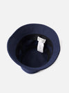 A close-up detail view of the Navy Canvas Lewis Hat against a plain studio backdrop, highlighting the embroidered eyelets, fine stitching details along the brim, and sturdy navy cotton fabric texture.