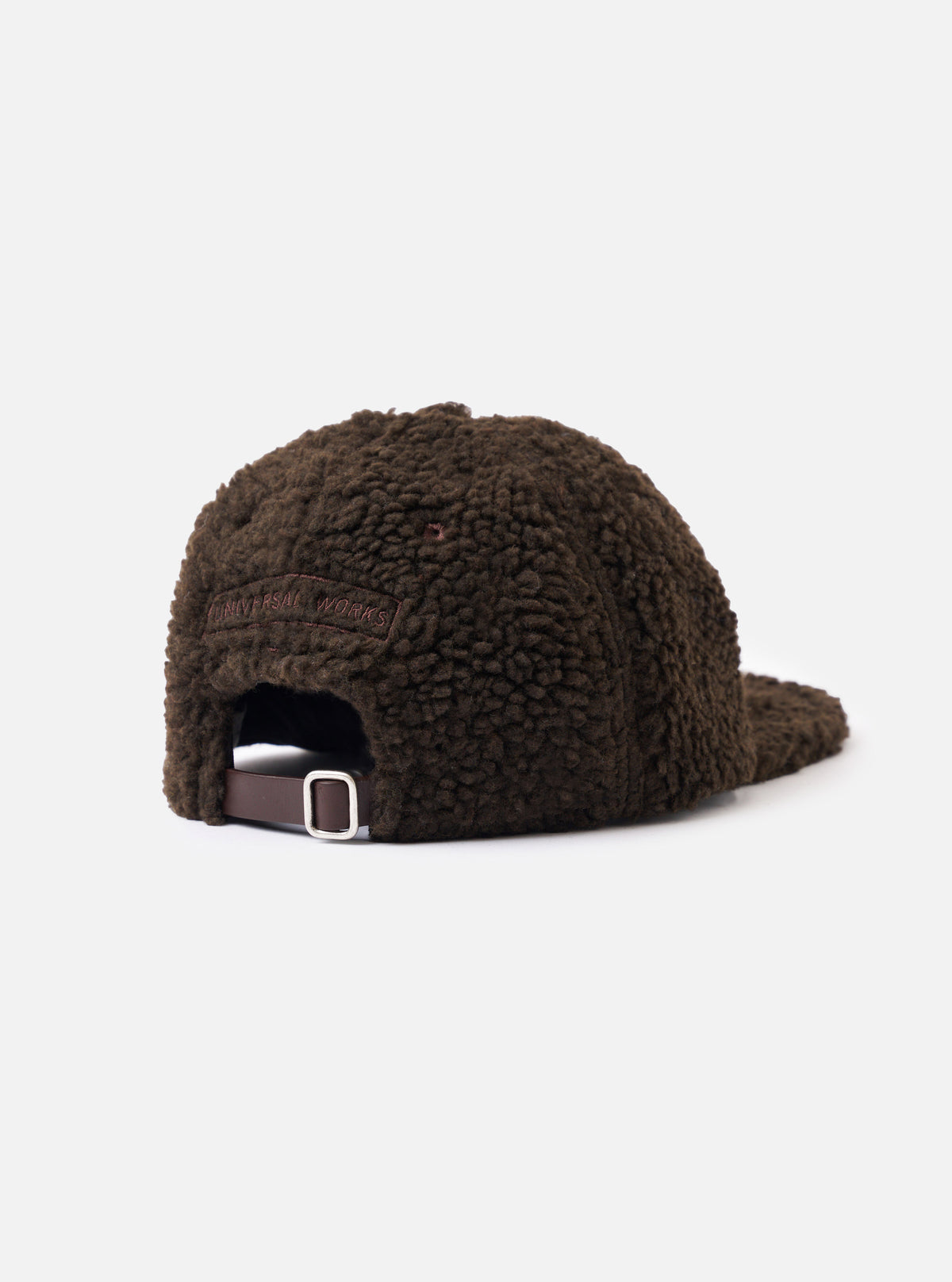 A detailed close-up shot of the Brown Galaxy Fleece Baseball Hat focusing on the textured fleece fabric surface, ventilation eyelets, and refined stitching against a neutral studio backdrop.
