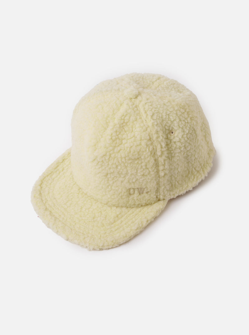 A side view shot of the Ecru Galaxy Fleece Baseball Hat on a neutral studio background, showcasing the crown shape, ventilation eyelets, and textured cream-colored fleece material.