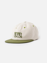 A front view of the Ecru/Olive Canvas Baseball Hat displayed on a white background. The image showcases the six-panel cotton canvas crown, contrasting olive peak, and clean stitching details across the front.