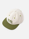A side profile view of the Ecru/Olive Canvas Baseball Hat against a plain white background. The prominent olive peak, ventilation eyelets, and the structured shape of the ecru canvas crown are featured.