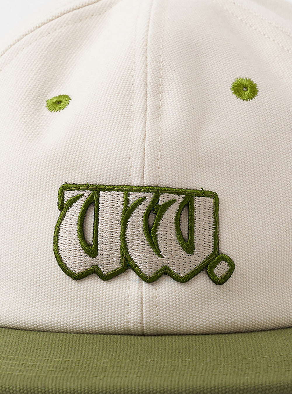 A back view image of the Ecru/Olive Canvas Baseball Hat on a neutral white background. The key focus is the adjustable brown leather strap with a metal clasp and embroidered branding near the rear panel.
