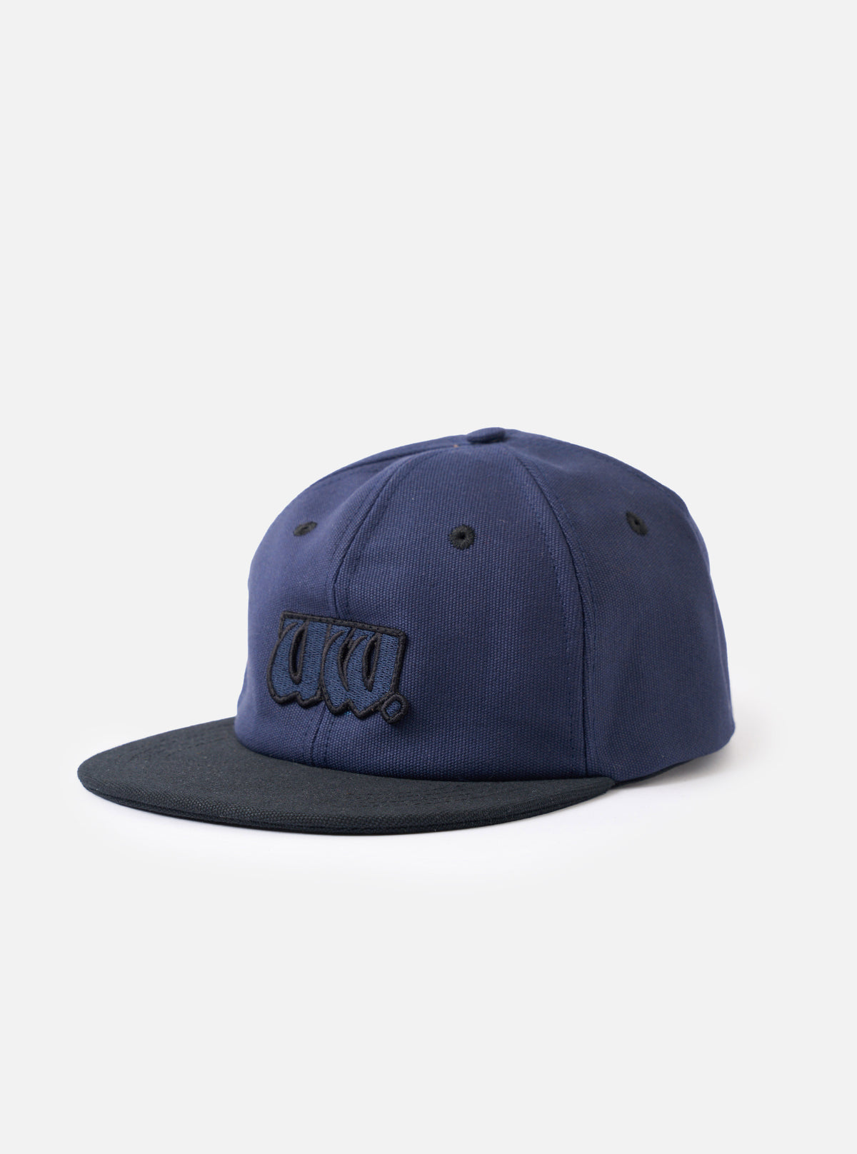 A front-facing view of the Navy/Black Canvas Baseball Hat presented on a white background. The cap displays a navy cotton canvas six-panel crown, contrasting black wide peak, and precise structural stitching.
