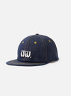 A front view of the Indigo 13oz Selvedge Denim Baseball Hat presented on a plain white background. The image showcases the dark indigo denim fabric, six-panel crown construction, and curved visor.