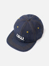 A side profile view of the Indigo 13oz Selvedge Denim Baseball Hat shown on a white background. The photo highlights the sturdy indigo denim texture, ventilation eyelets, and classic cap silhouette.