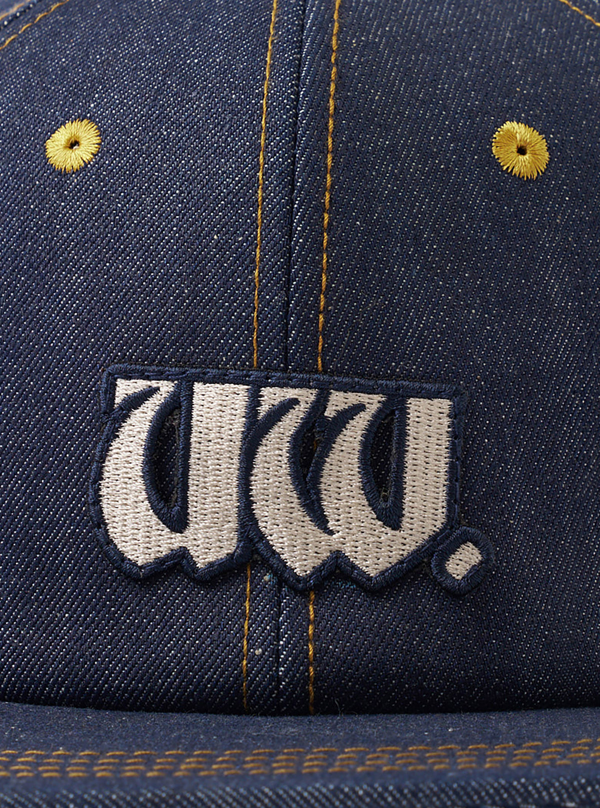 A rear view image of the Indigo 13oz Selvedge Denim Baseball Hat set on a plain white background. The focus is on the adjustable back strap with a metallic buckle and the dark indigo denim panels.
