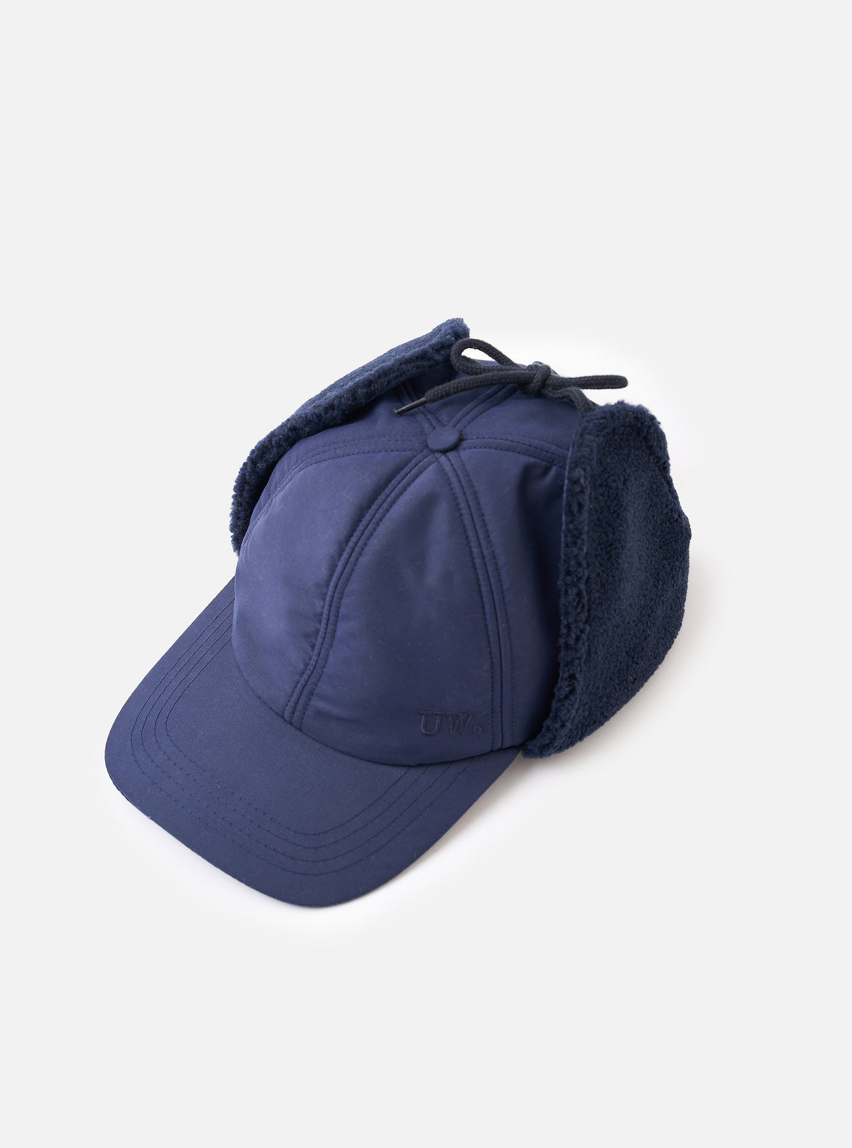 A side view studio image of the Navy Brushed WR Nation Winter Baseball Hat against a solid white background, highlighting the side profile, curved brim, subtle ventilation eyelet, and soft navy technical fabric.
