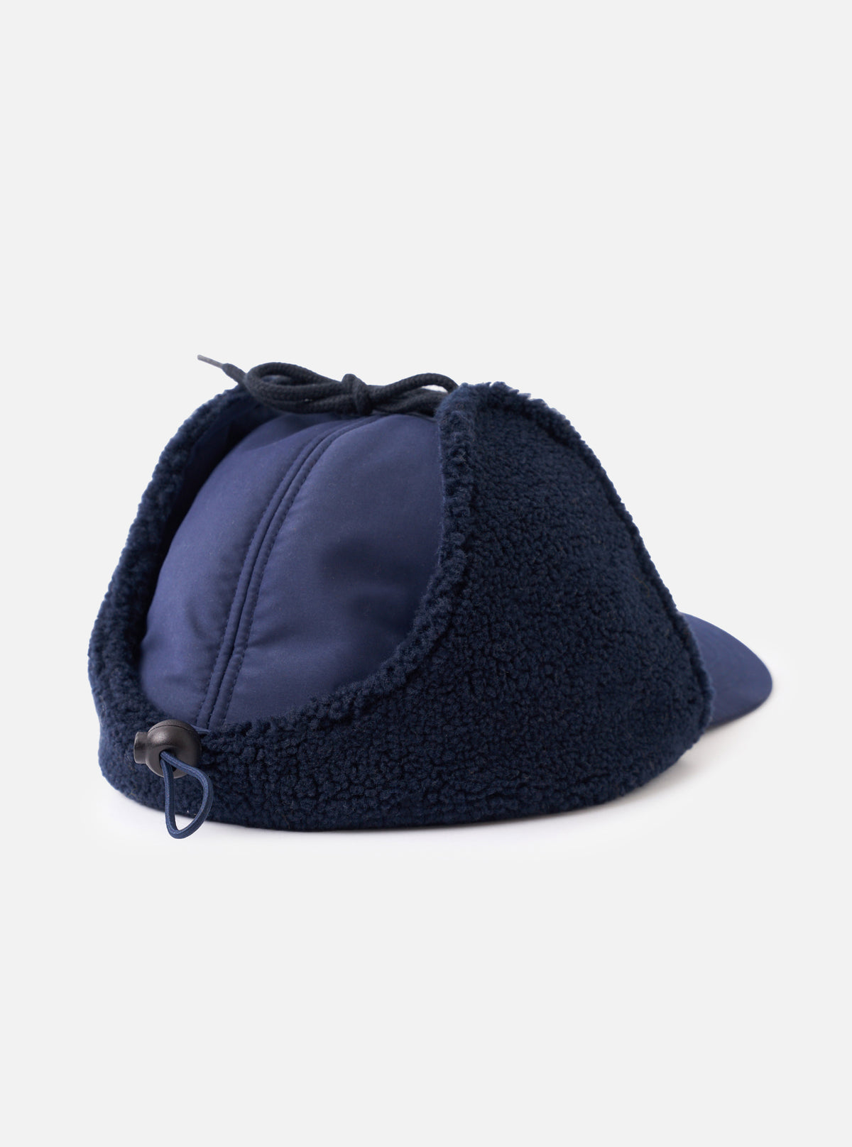 A detailed view showing the interior and ear flaps of the Navy Brushed WR Nation Winter Baseball Hat set against a plain white studio background, highlighting the cozy fleece lining and dark navy fabric construction.