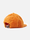 An interior close-up shot of the Orange Artic Fleece Baseball Hat against a plain white studio backdrop, revealing the internal sweatband, reinforced panel seams, and inner construction details.