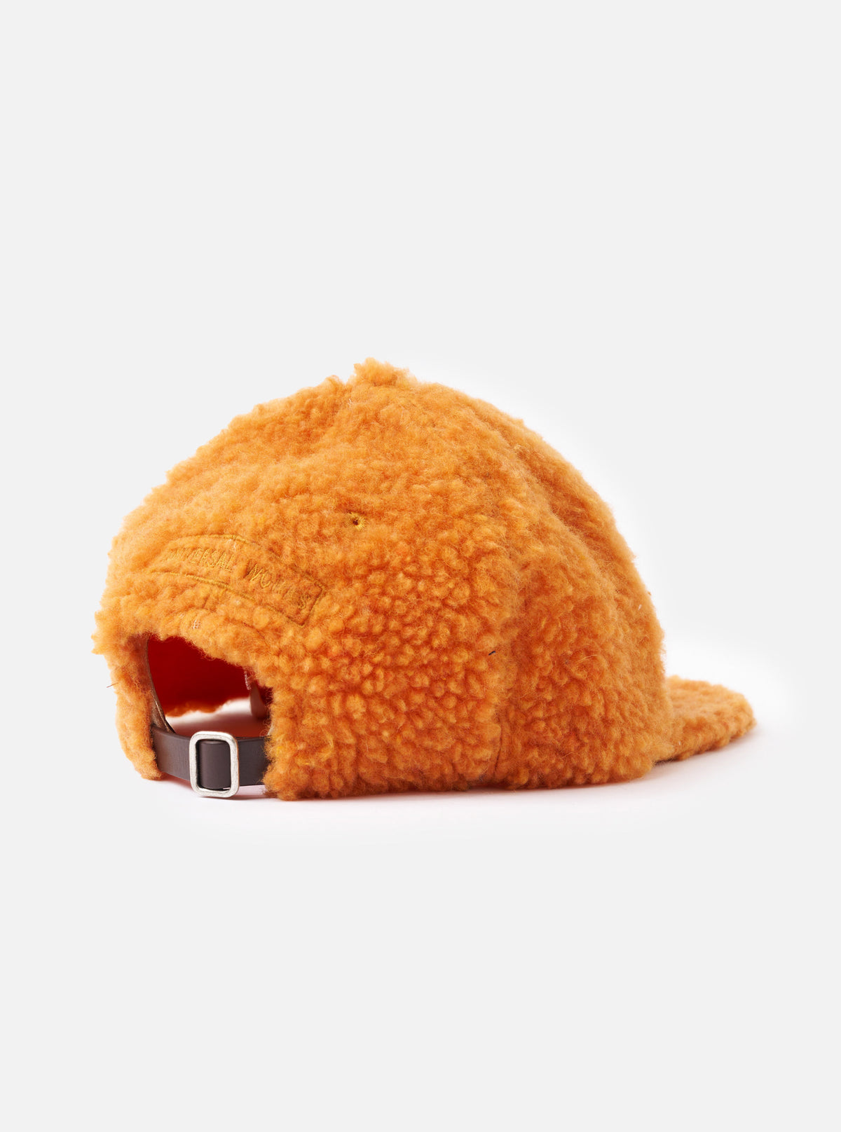 An interior close-up shot of the Orange Artic Fleece Baseball Hat against a plain white studio backdrop, revealing the internal sweatband, reinforced panel seams, and inner construction details.