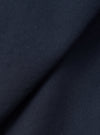 A close-up fabric swatch shot of the Navy Micro Canvas Warmus Jacket on a plain white background, highlighting the fine weave, subtle texture, and deep dark navy blue color of the cotton canvas material.