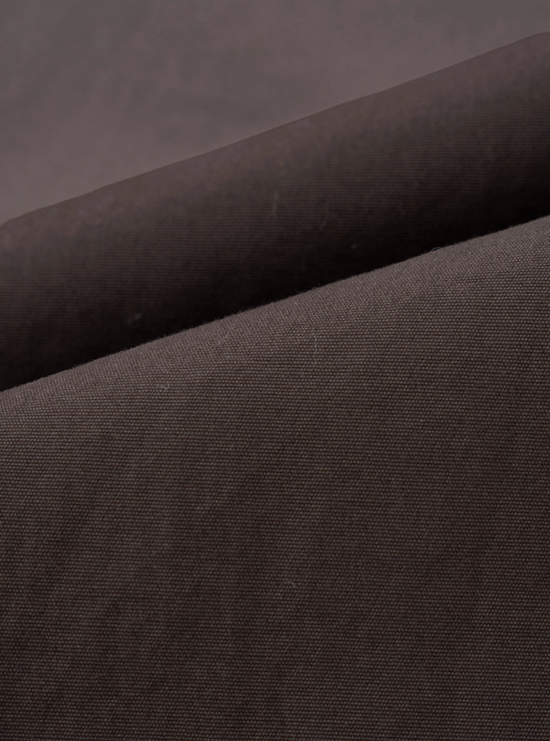 A close-up fabric swatch image showing the fine micro-canvas texture of the Brown Micro Canvas Military Chino against a plain white background, highlighting the rich brown tone and durable cotton weave of the garment.