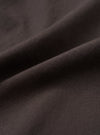 A close-up fabric swatch image of the Brown Micro Canvas Oxford Pant set against a solid white background, displaying the tight weave, fine surface texture, and natural shade of the brown cotton canvas material.