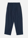 Front view photograph of the Navy Micro Canvas Oxford Pant on a plain white studio backdrop. The image demonstrates the loose wide-leg cut, drawstring waist, front pleating, and dark navy blue micro-canvas cotton material.