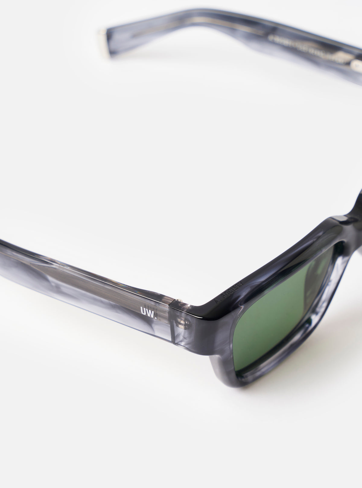 Side profile shot of the A. SOCIETY x Universal Works Grey Havana Hollywood Sunglasses on a clean background, featuring the grey Havana pattern along the temple arms and frame edge.
