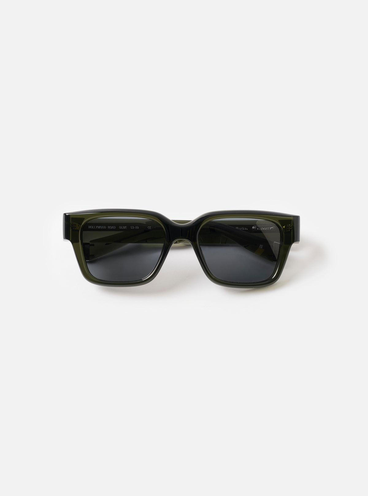 Front view of the A. SOCIETY x Universal Works Olive Hollywood Sunglasses on a plain white background, highlighting the olive green acetate frame, tinted lenses, and classic keyhole bridge detail in a clean studio setting.