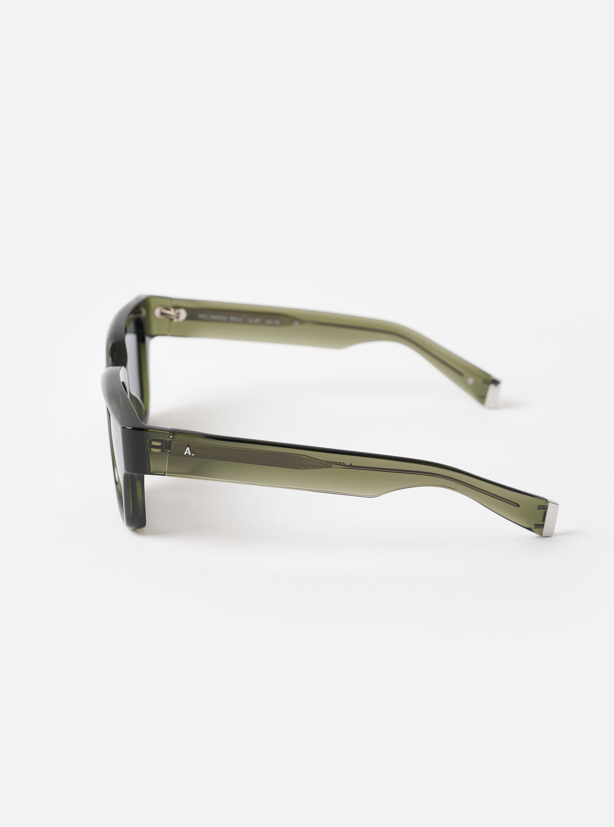 Detailed close-up shot of the A. SOCIETY x Universal Works Olive Hollywood Sunglasses resting on a white background, highlighting the fine metallic hardware details, temple tips, and smooth olive finish.