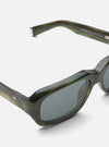 Close-up of A. SOCIETY x Universal Works Green Aberdeen Sunglasses on a white surface. The green marbled frames and grey lenses are clearly visible.