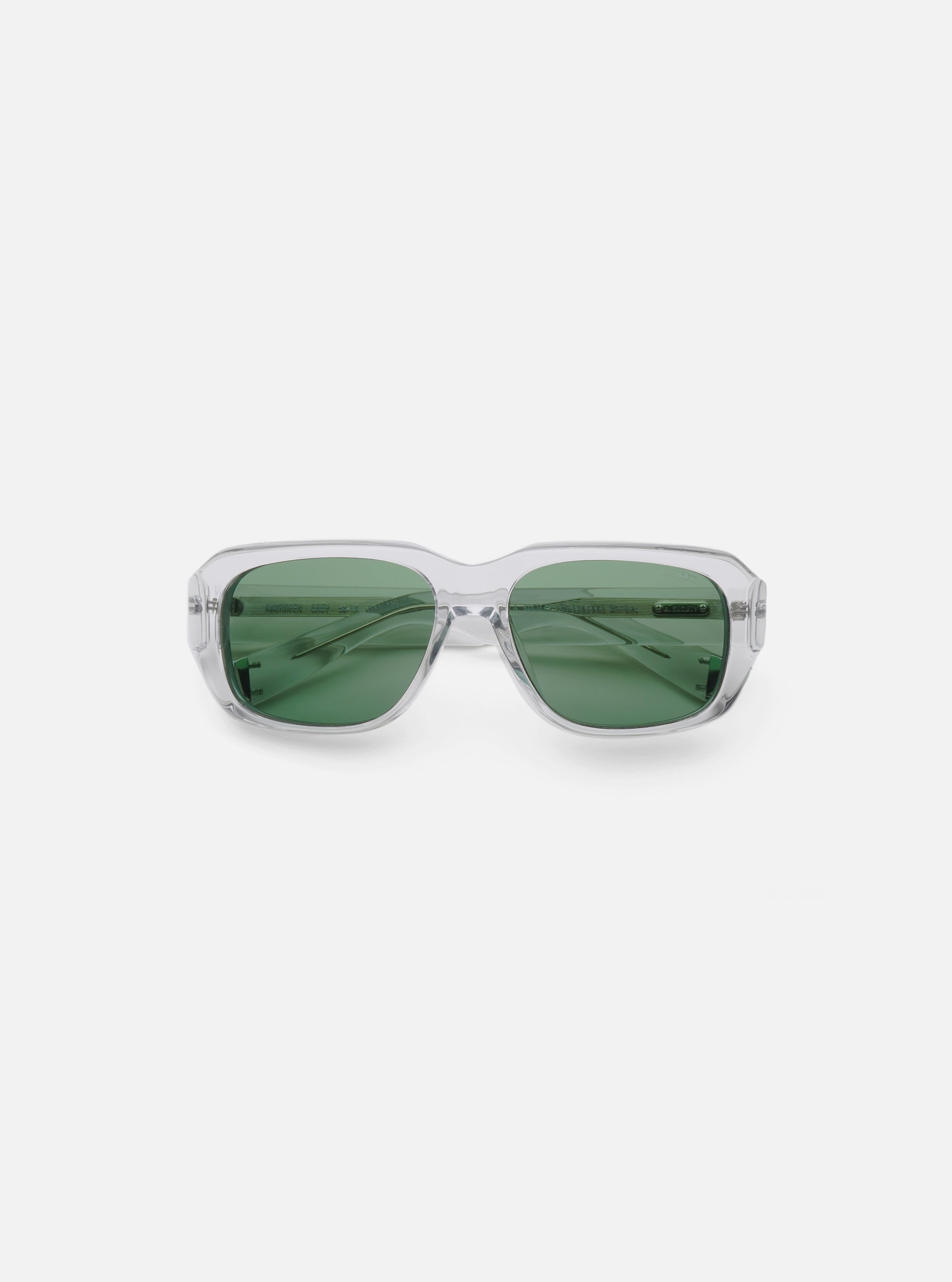 Close-up of A. SOCIETY x Universal Works Grey Aberdeen Sunglasses on a white background. The frames are clear grey and the lenses are green.