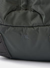 Close-up of the F/CE.® Grey Recycled Nylon 420 re/cor Travel Backpack on a white surface. The brand logo is visible on the grey nylon material.
