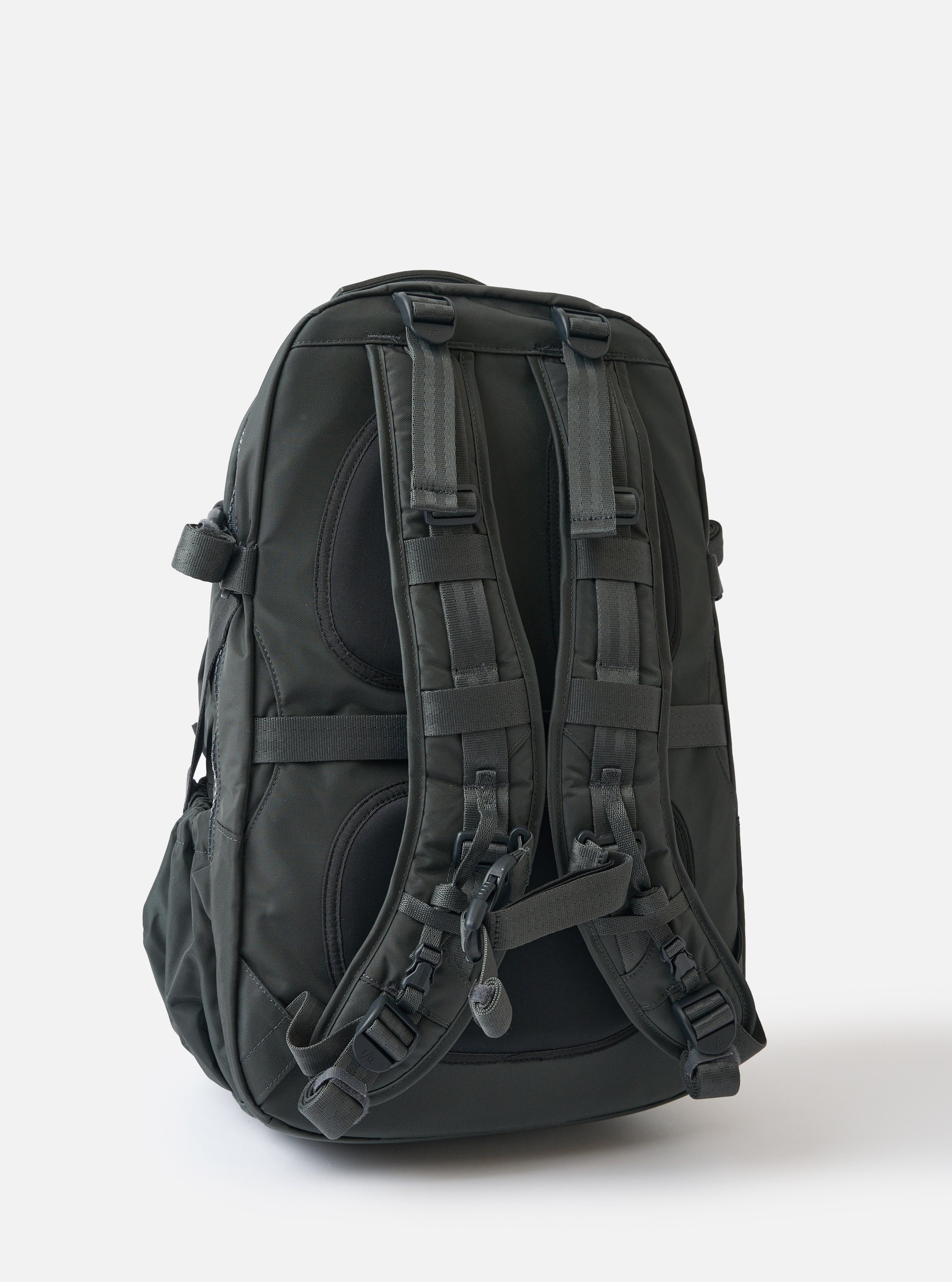 Rear view of the F/CE.® Grey Recycled Nylon 420 re/cor Travel Backpack on a white background. The backpack is grey nylon with black straps and buckles.