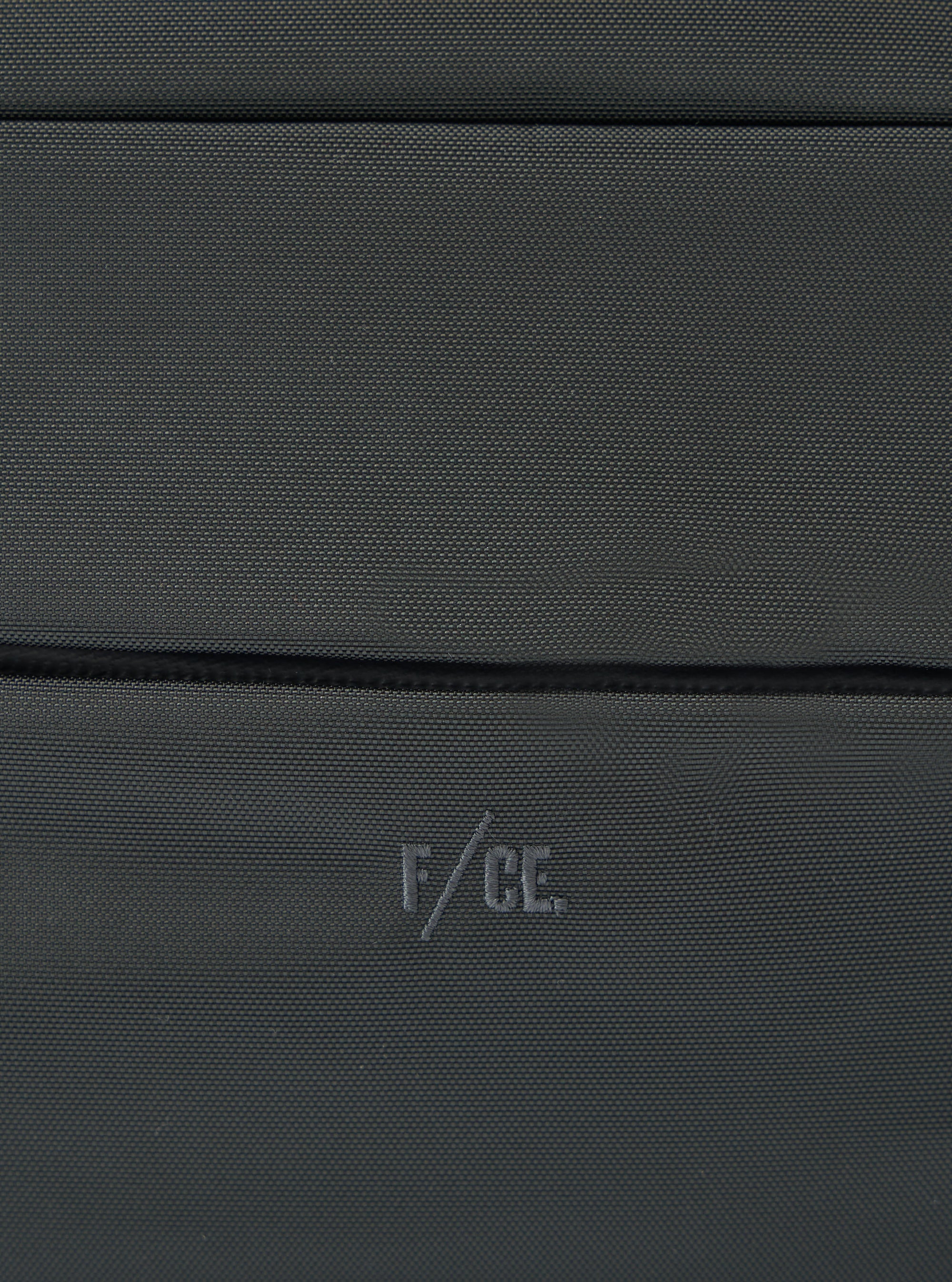 Close-up of the F/CE.® Grey 420 re/cor Sacoche showing the texture of the grey material and the subtle F/CE. logo. Studio shot.