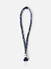 Hanami of Rome Blue/White Leather/Blue Bead Bandana Necklace No.47 on a white surface. The necklace is made of braided blue and white fabric with a blue bead detail.