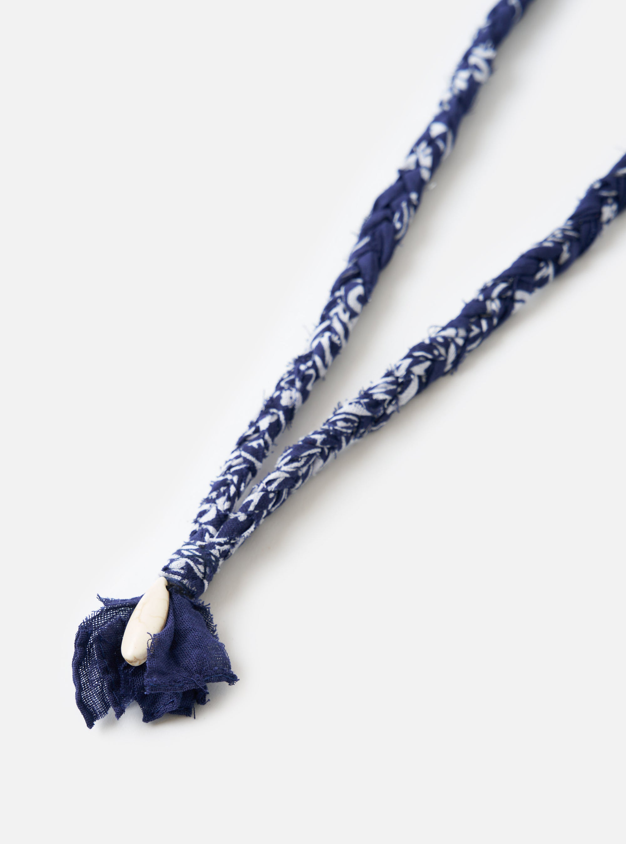 Close-up of the Hanami of Rome Blue/White Turquoise Pendant Bandana Necklace No.51 on a white background. The necklace features a blue and white braided band and a turquoise pendant.