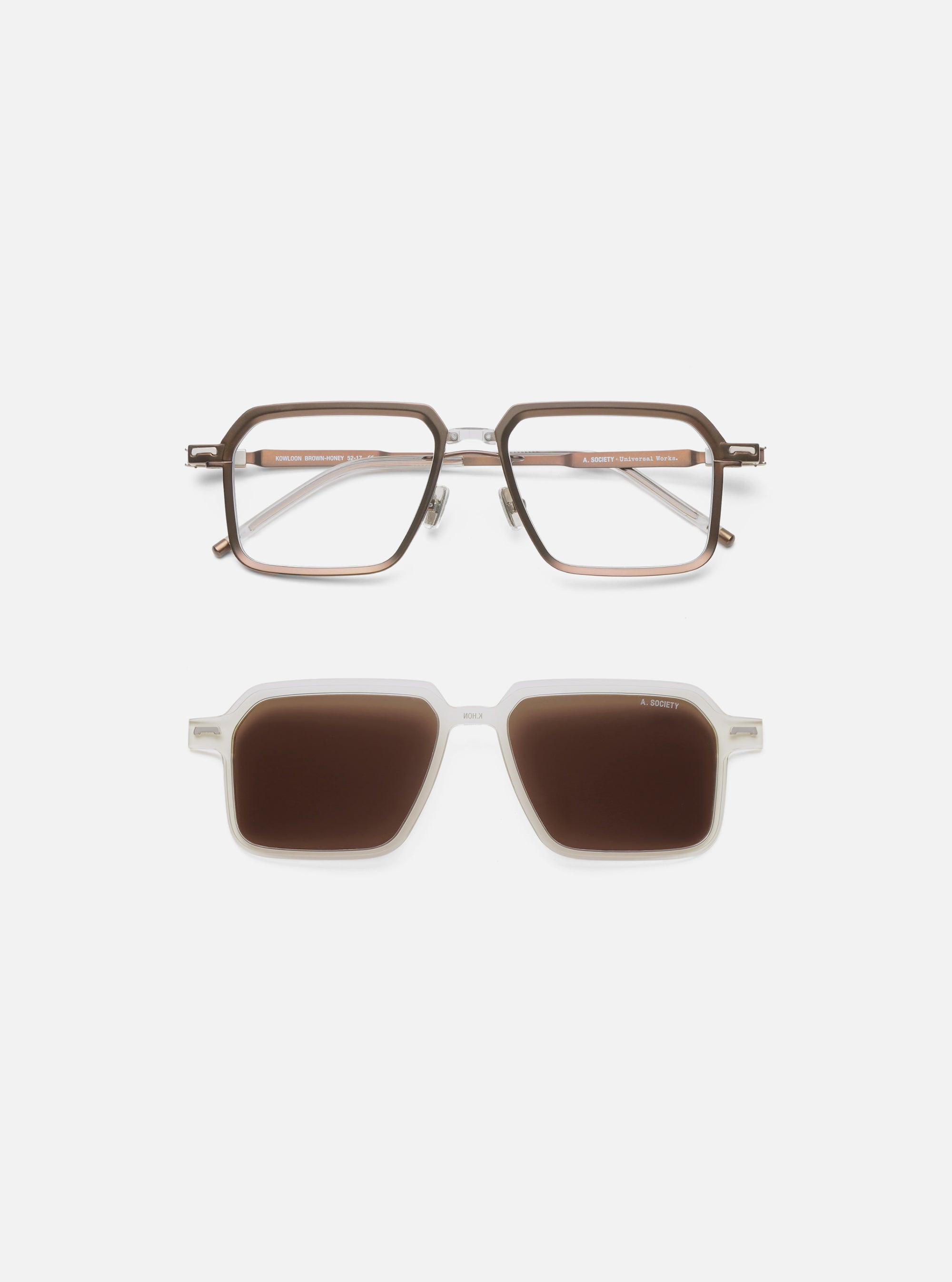 A. SOCIETY x Universal Works Brown/Honey Kowloon Eyewear on a white surface. The glasses have a brown and honey-colored frame. Below are sunglasses with a white frame and brown lenses.