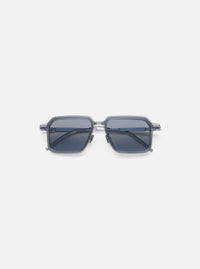 A. SOCIETY x Universal Works Silver/Grey Kowloon Eyewear on a white background. These square framed glasses have silver metal details and grey tinted lenses.
