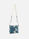 master-piece x Universal Works Blue Camo Recycled Tech Canvas Sacoche bag in blue camo print, hanging against a white background with a beige strap and black drawstrings.