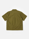 The master-piece x Universal Works Olive Recycled Poly Tech Tech Overshirt is shown from the back as a flat lay against a plain white background. The image highlights the garment's clean construction, featuring a back yoke with a central box pleat and a straight hem. The olive green recycled polytech fabric has a smooth, technical appearance.