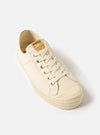 Studio shot of the Novesta for Universal Works Ecru Canvas Star Master. The ecru canvas shoe is on a white background.