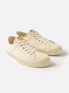 The Novesta for Universal Works Ecru Canvas Star Master shoes on a white background. The shoes are ecru canvas with white laces and a rubber sole.